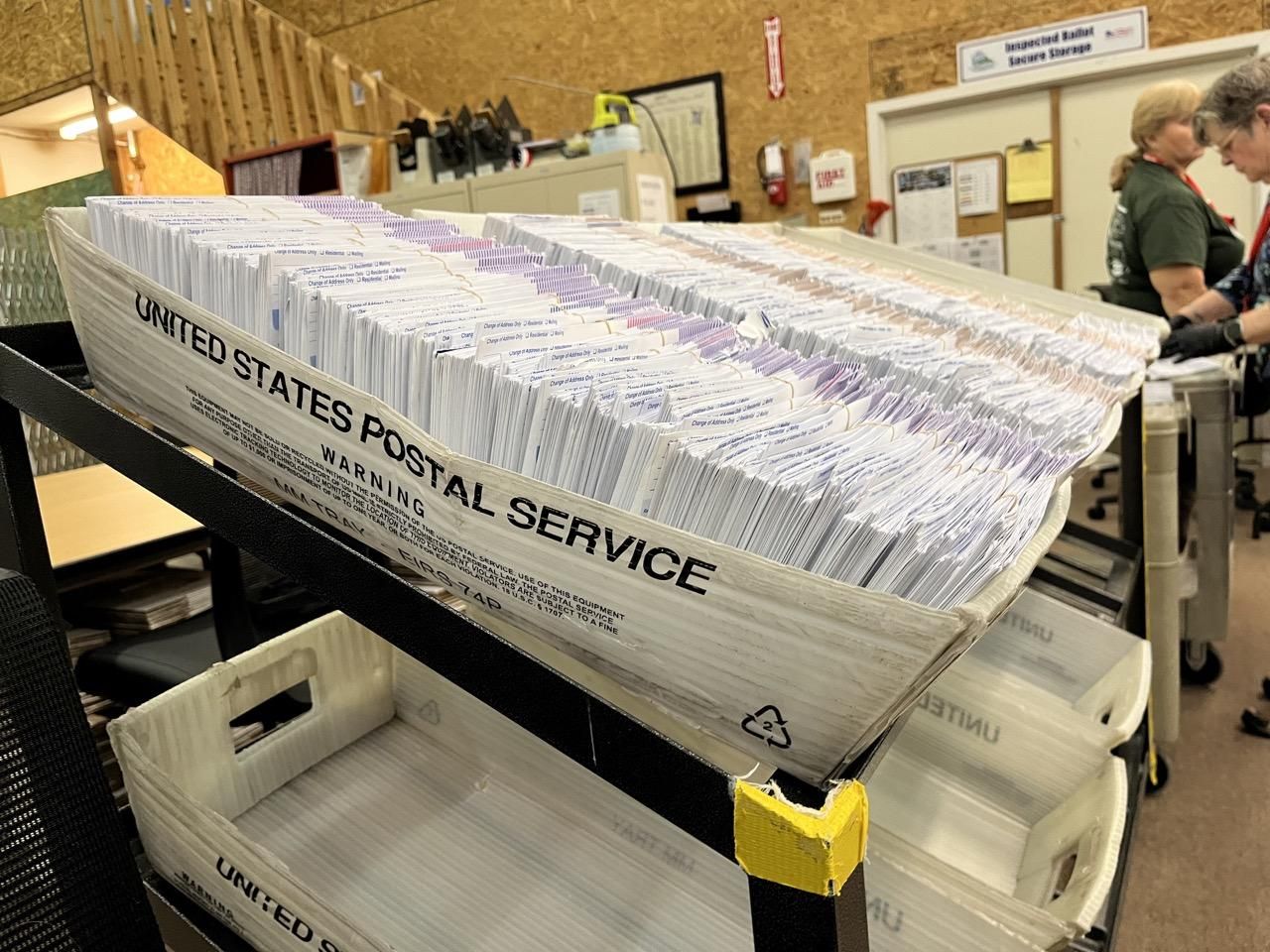 photo: Ballot envelopes sit in the Thurston County elections center. (Laurel Demkovich/Washington State Standard) Vote-at-home is the law in Washington — and it works